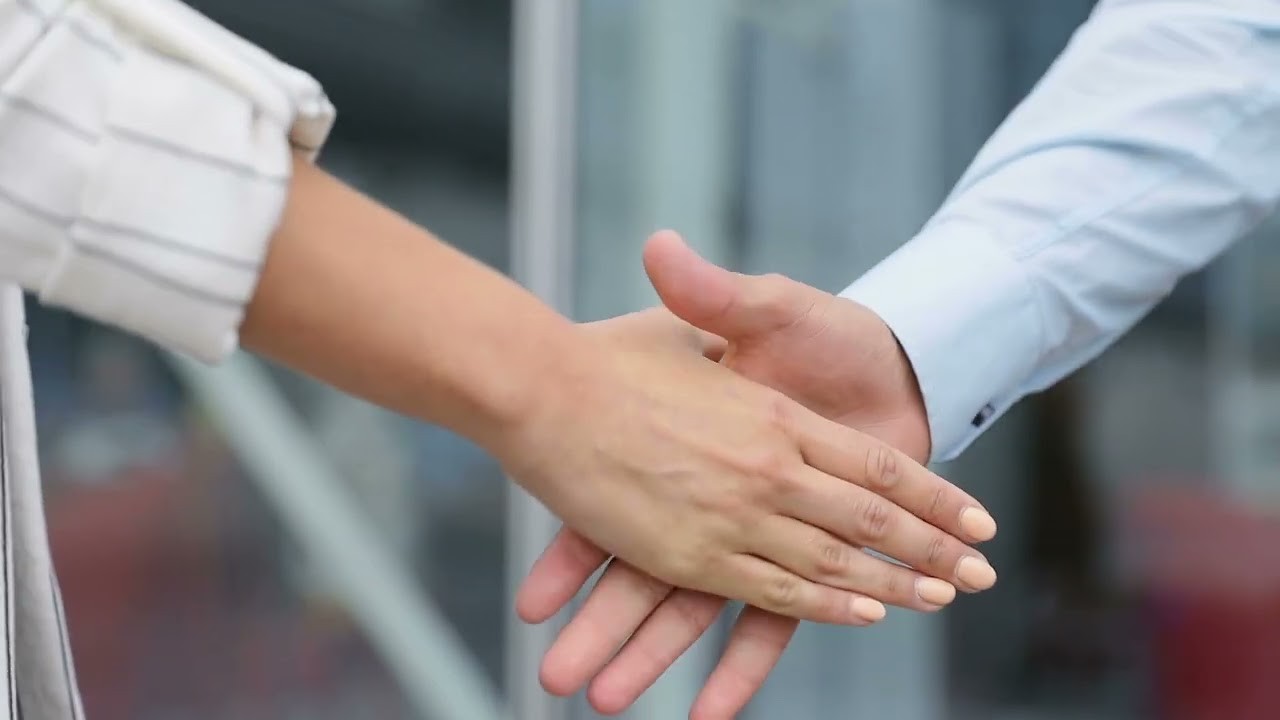 business people shaking hands closeup people